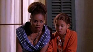 Mozelle (Debbi Morgan) and Eve (Jurnee Smollett) talking on the porch at night in Eve's Bayou