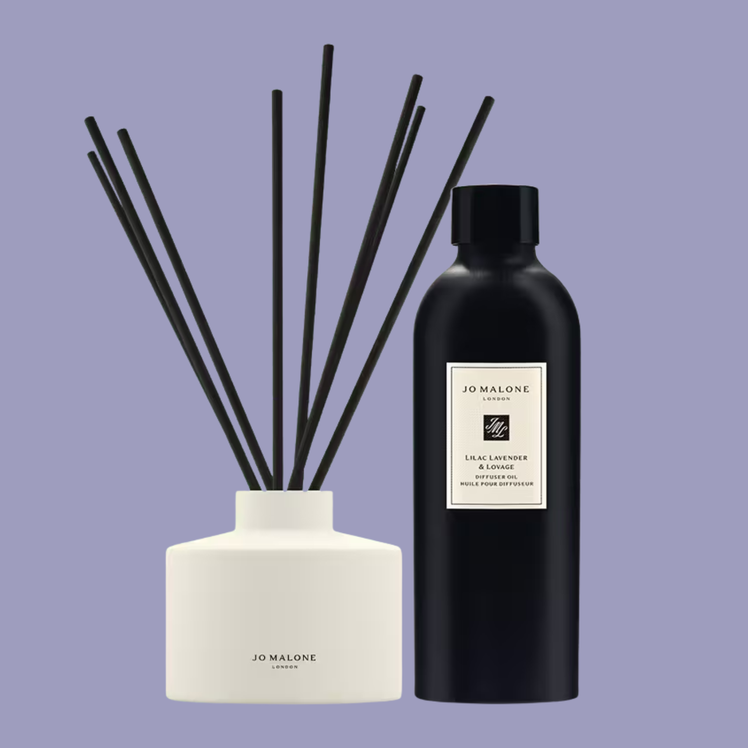 A white ceramic diffuser bottle with black reeds and a black bottle of refill