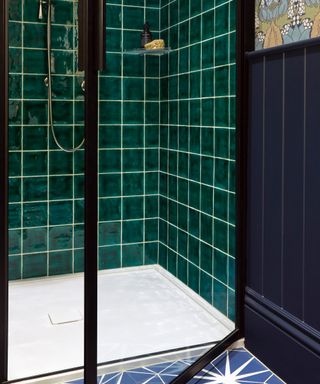 colors that go with dark green, shower with dark green square tiles, navy tongue and groove, wallpaper, blue and white star floor tiles