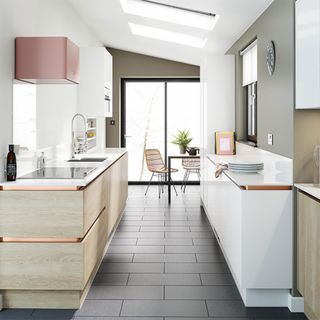 Kitchen with white wall and brown cabinets