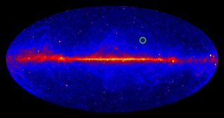 A map of the gamma-ray sky, created using four years of data collected by NASA's Fermi satellite. The color coding displays the intensity of the detected gamma radiation (low intensity = blue, medium intensity = red, high intensity = yellow). The newly discovered radio pulsar PSR J1311-3430, a strong gamma-ray source, is marked by a green circle.