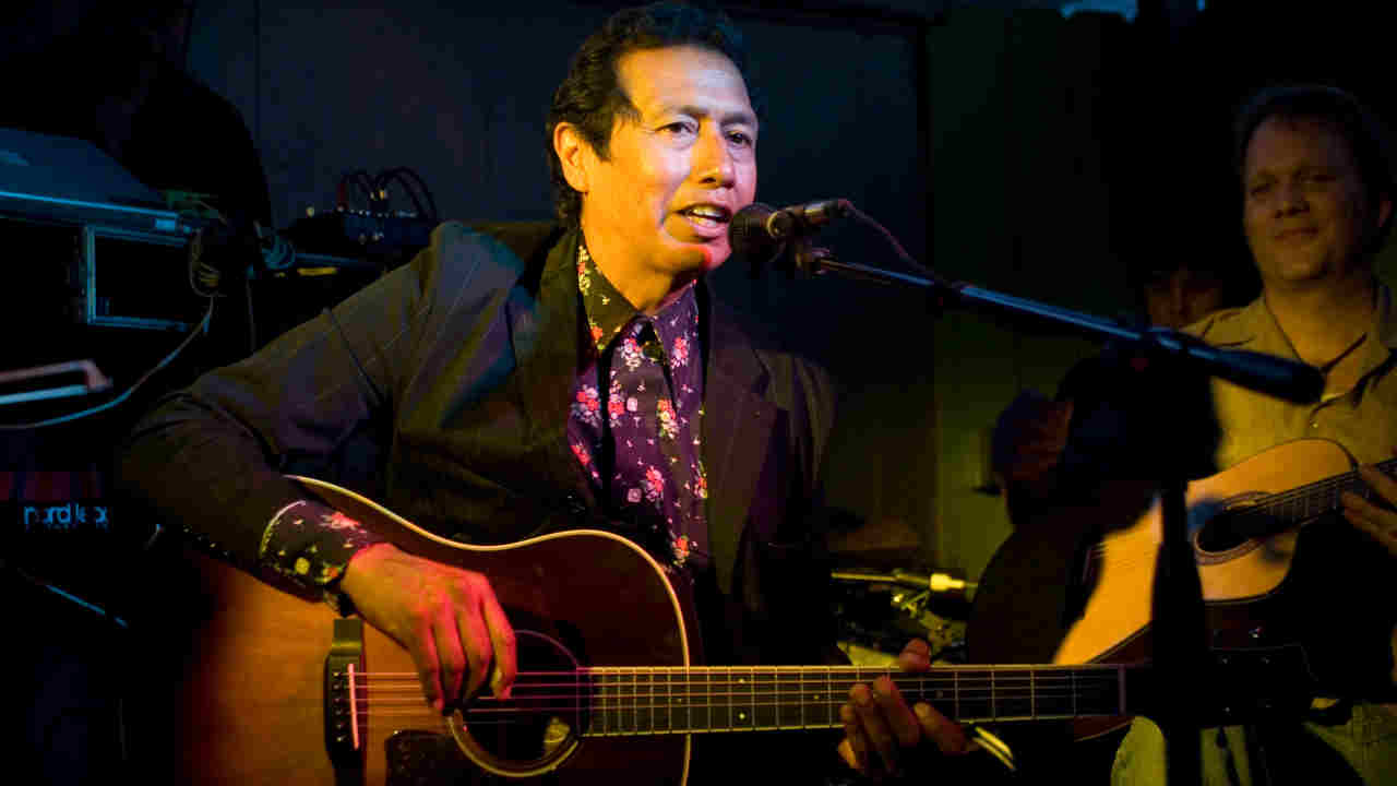 Alejandro Escovedo performing onstage in 2006