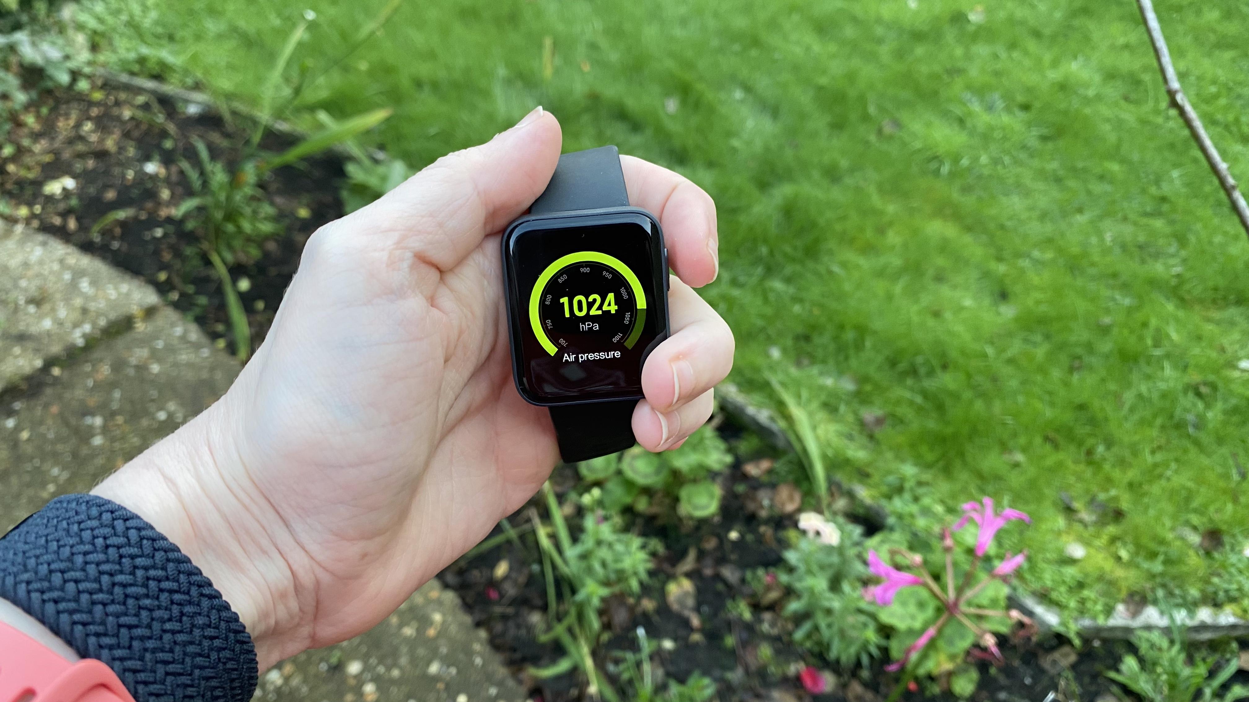 A Xiaomi Mi Watch Lite in someone's hand