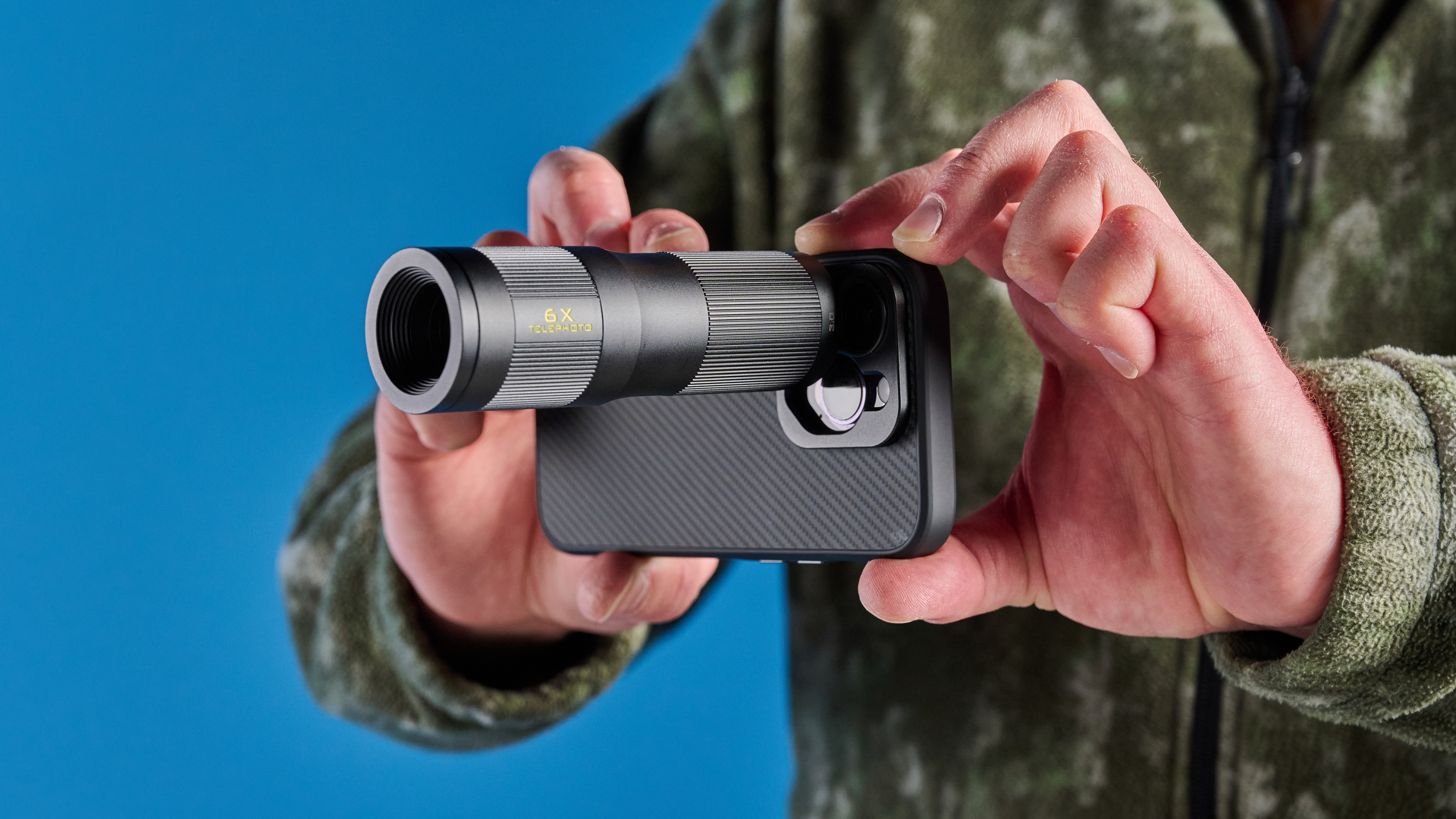 The Freewell iPhone lens 6x on a phone in hand