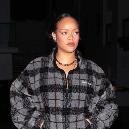 Rihanna wearing the Miu Miu Checked Teddy Jacket with track pants and snakeskin boots