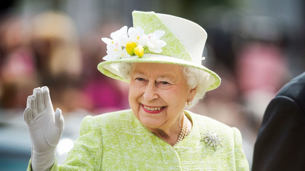 Queen Elizabeth II waves during a walk about around Windsor on her 90th Birthday on April 21, 2016 in Windsor, England.