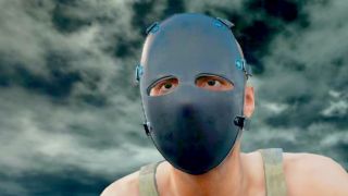 A PlayerUnknown's Battlegrounds character wearing a creepy mask.