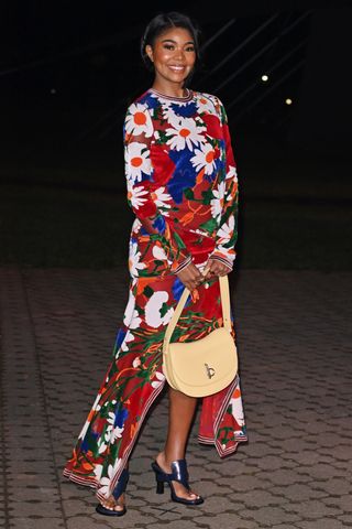 Gabrielle Union Burberry show Daniel Lee floral dress thong sandals heels yellow saddle bag London Fashion Week