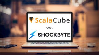 ScalaCube and Shockbyte logo on open laptop on a desk