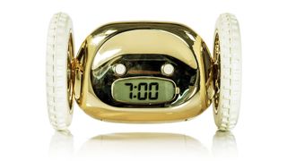 Clocky review: the alarm clock in chrome gold with white wheels