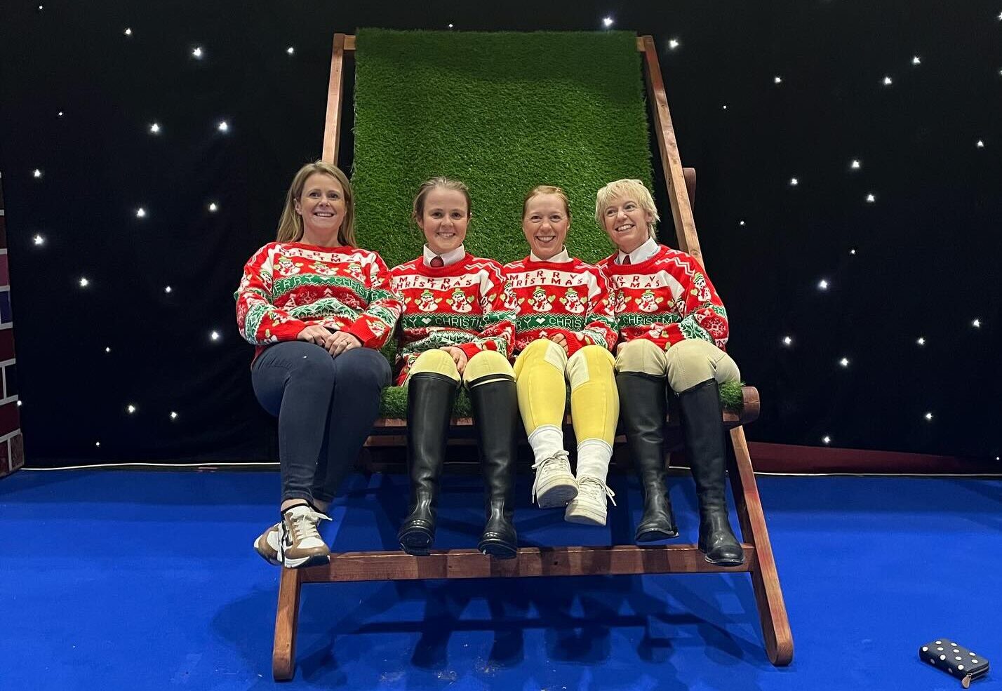 Bethan and her friends wearing their Christmas jumpers after showing at London International