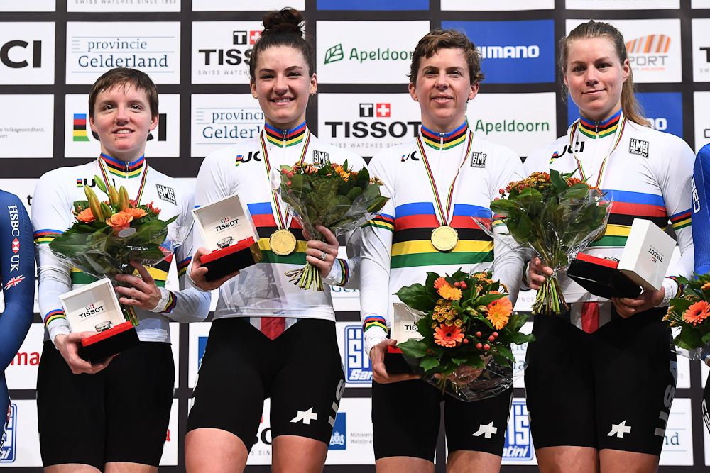 US women's team pursuit squad on the podium after winning the gold medal at the 2018 Track World Championships