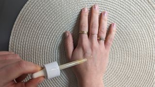 Demonstration of how to use Vitamin C serum on Beauty Ed's hand - you only need to apply a pea-sized amount to clean, dry skin