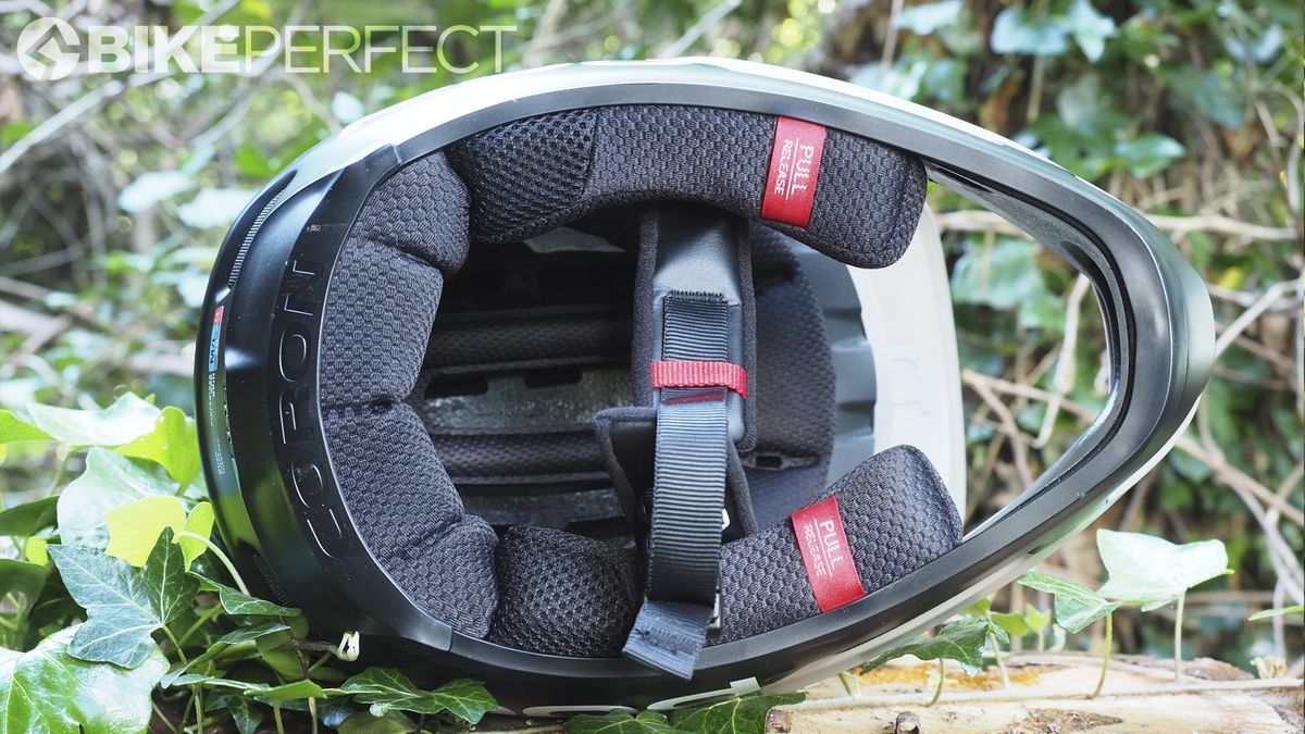 POC Coron Air SPIN full-face helmet on its side showing straps and cushioning