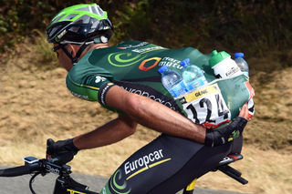 Yohann Gene carries bottles of water on stage thirteen of the 2015 Tour de France