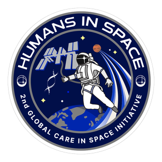 A circular patch that reads, "Humans in Space" across the top boarder, and "2nd Global Care in Space Initiative" along the bottom. In the middle, an astronaut floats above the circular curve of Earth, with a shooting meteor and the outline of the International Space Station behind them.