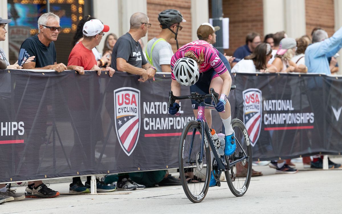 Brenna Wrye-Simpson (DNA Pro Cycling) put her head down and attacked out of the final corner.
