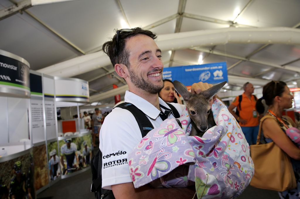 Nathan Haas (Dimension Data) enjoying a cuddle with a joey