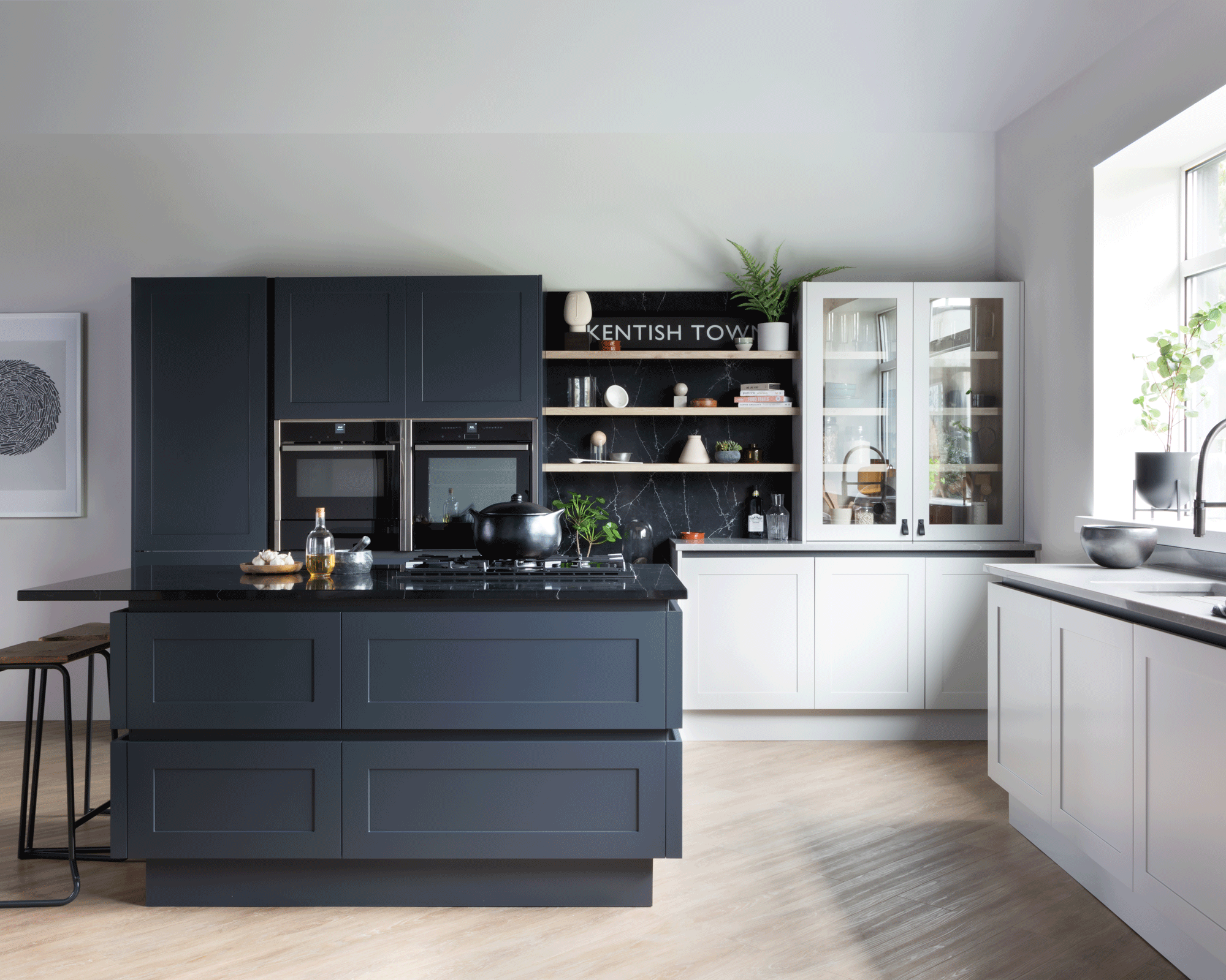 Two tone kitchen with grey and white cabinetry and open shelving