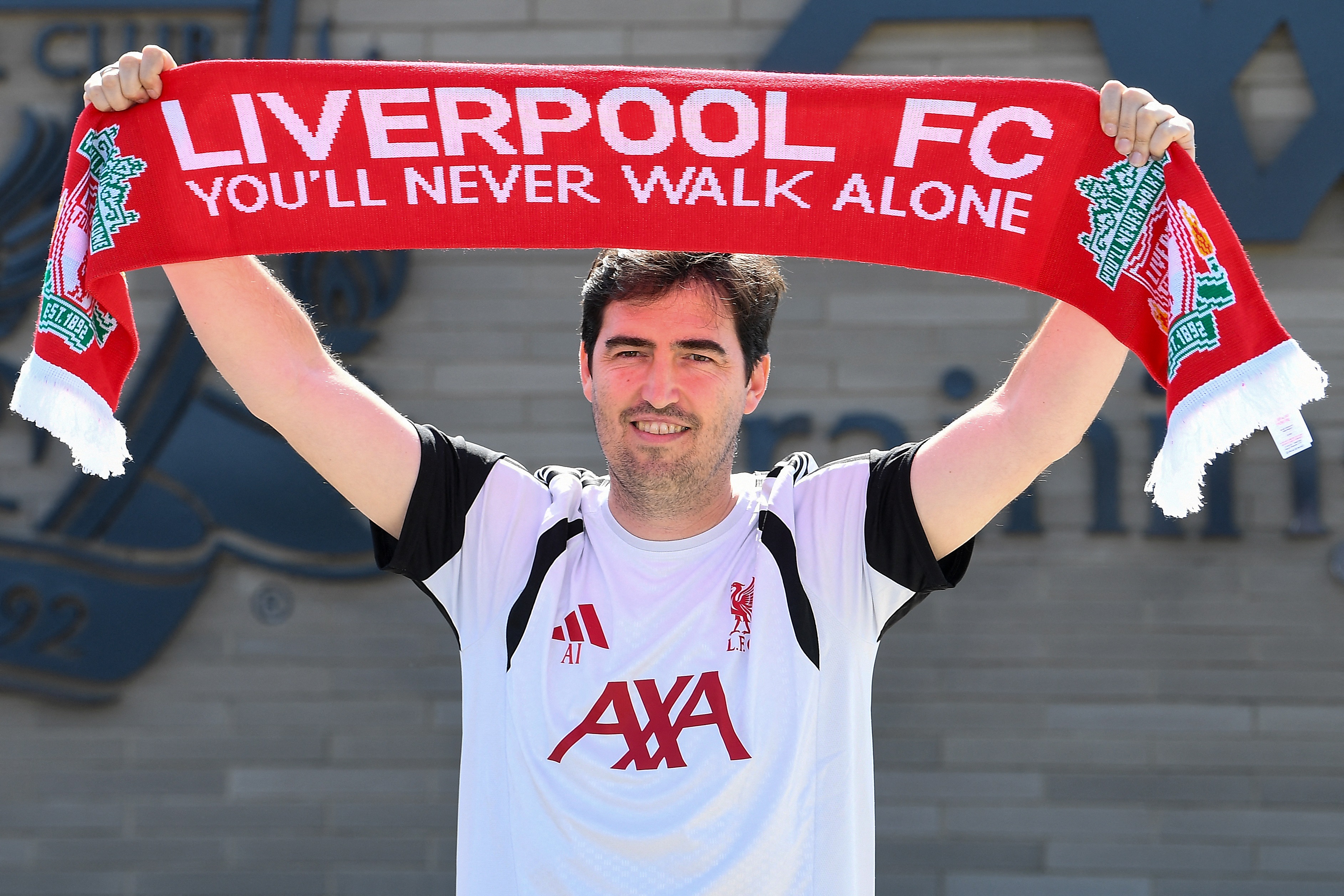 Andoni Iraola, the new manager for English Premier League football side Liverpool, poses as he meets the media at the team's training ground in Kirkby, Liverpool, north-west England on July 13, 2026.