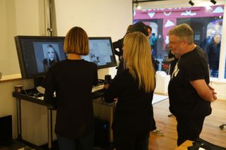 Portrait photographer Rankin viewing portraits with Sarah Taylor at RankinLive London Carnaby Street, November 2023