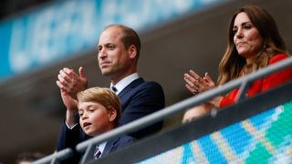 Prince William, Kate Middleton and Prince George celebrate the win in the UEFA EURO 2020 round of 16 football match between England and Germany at Wembley Stadium in London on June 29, 2021.