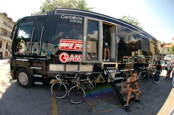 A Footon-Servetto rider waits on the steps of the team's motorhome