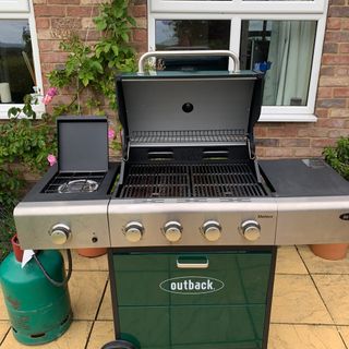 Green BBQ with lid open