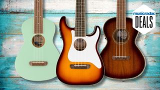 Three ukuleles against a wooden background