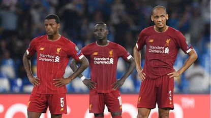 Liverpool’s Georginio Wijnaldum, Sadio Mane and Fabinho react during the defeat against Napoli 