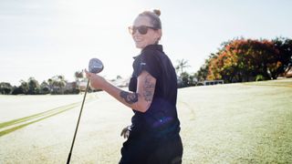 Woman golfing
