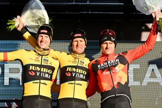 KUURNE BELGIUM FEBRUARY 26 LR Nath Van Hooydonck of Belgium and Team JumboVisma on second place race winner Tiesj Benoot of Belgium and Team JumboVisma and Matej Mohoric of Slovenia and Team Bahrain Victorious on third place pose on the podium ceremony after the 75th Kuurne Bruxelles Kuurne 2023 a 1931km one day race from Kuurne to Kuurne kuurnebrusselkuurne on February 26 2023 in Kuurne Belgium Photo by Luc ClaessenGetty Images