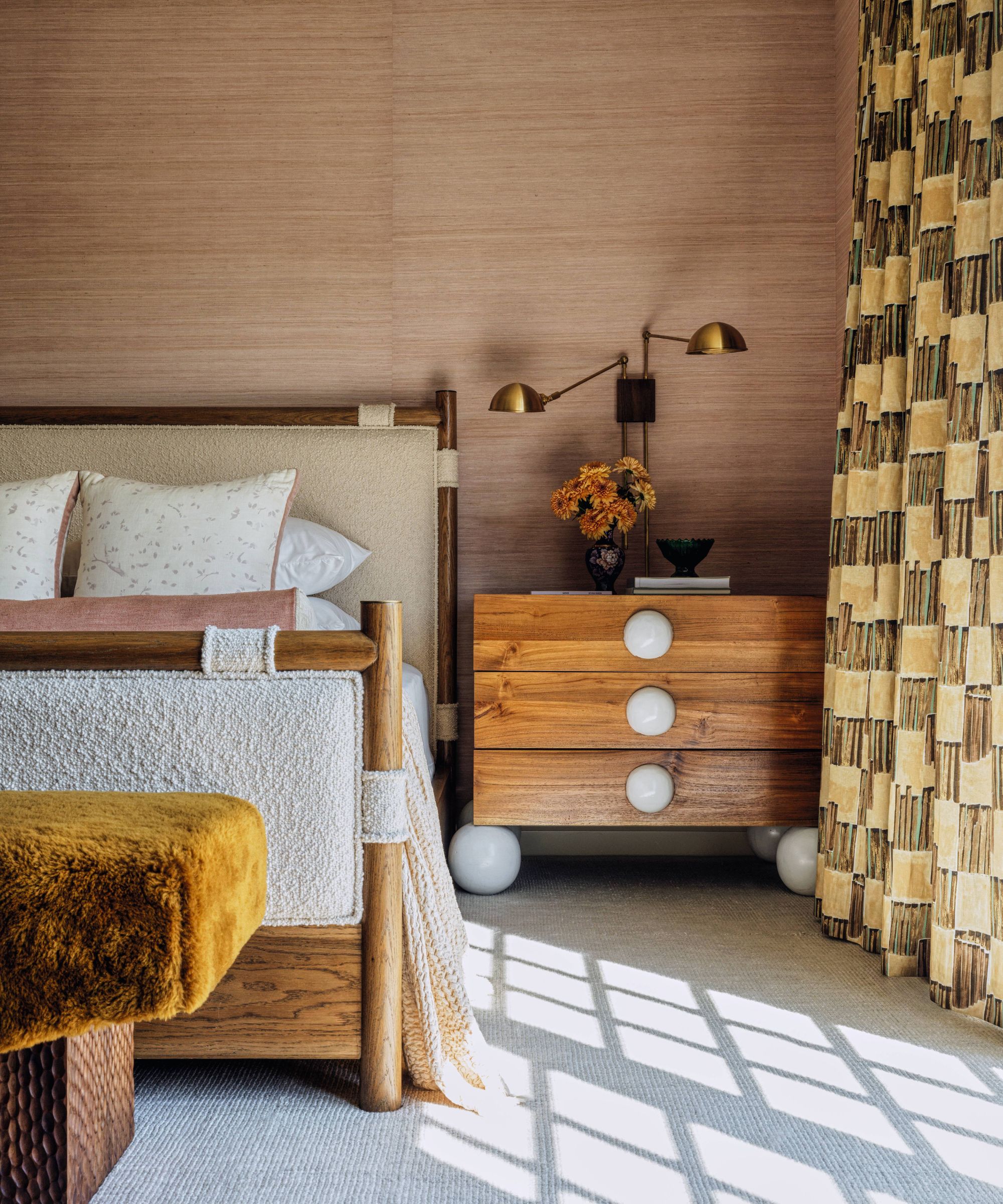 Bedroom with wood effect walls, checkered drapes and wooden bed, upholstered in white boucle