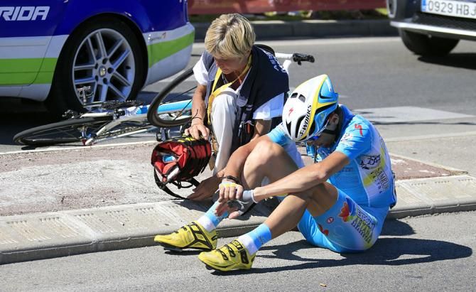Janez Brajkovic (Astana) sits after a crash before getting up and trying to get back into the race