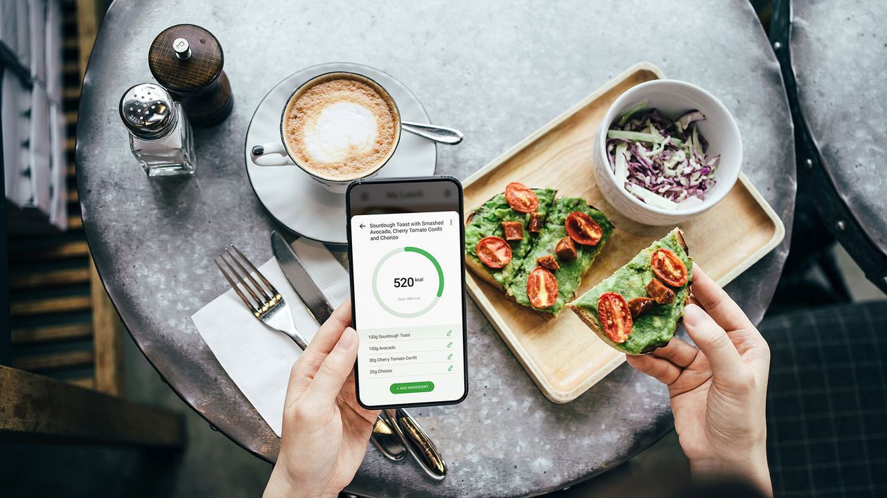 Woman calculating how many calories she is consuming