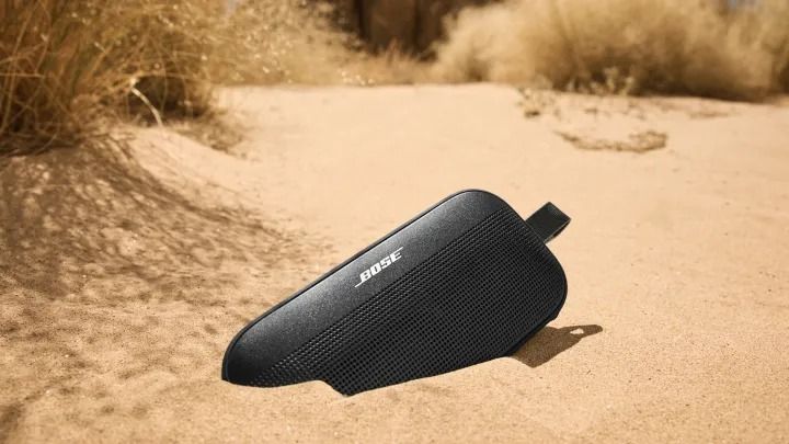 Bose SoundLink Flex Gen 2 semi-buried in sand