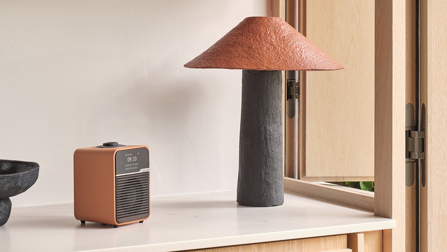 Ruark R1S Terracotta special edition radio on a shelf in a living room