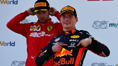 Max Verstappen celebrates after beating Charles LeClerc to win the Austrian GP