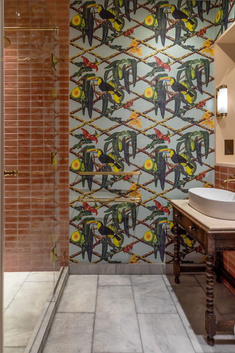 wallpapered bathroom with tiles