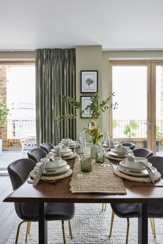 A transitional dining table dressed with simple decor