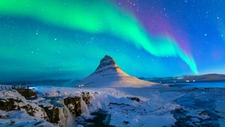 what is the Aurora Borealis: The Aurora Borealis above Kirkjufell in Iceland