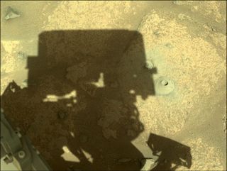 An image taken by the Perseverance rover of its first drill hole on Mars taken on Aug. 6, 2021.
