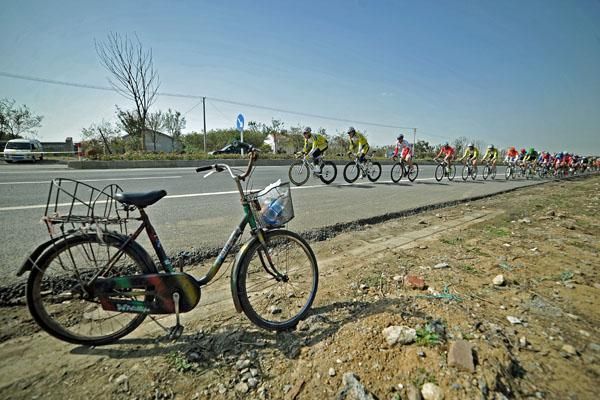 ASC Dukla Praha control the front of the peloton