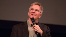 rick steves lecturing on a black background