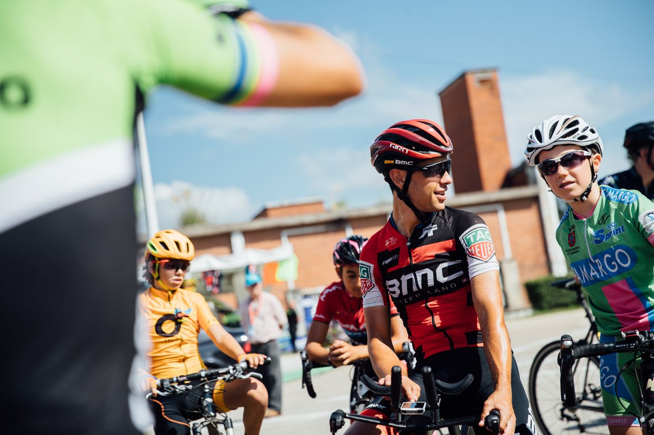 Richie Porte poses for photos with fans.