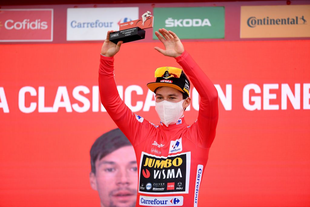 EJEADELOSCABALLEROS SPAIN OCTOBER 23 Podium Primoz Roglic of Slovenia and Team Jumbo Visma Red Leader Jersey Celebration Trophy Mask Covid safety measures during the 75th Tour of Spain 2020 Stage 4 a 1917km stage from Garray Numancia to Ejea de los Caballeros lavuelta LaVuelta20 La Vuelta on October 23 2020 in Ejea de los Caballeros Spain Photo by David RamosGetty Images