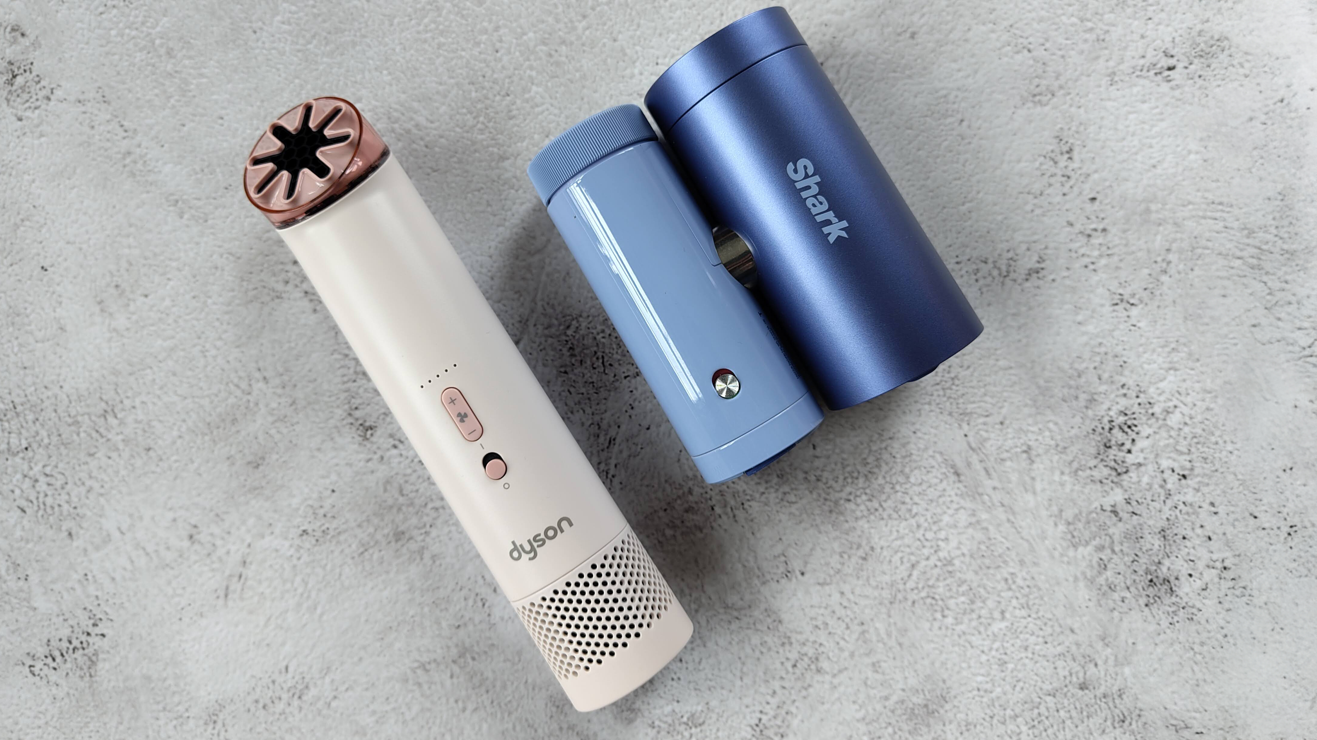 Dyson HushJet Mini Cool Fan and Shark ChillPill fans on marble-effect table