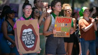 women holding pro abortion signs during US protest