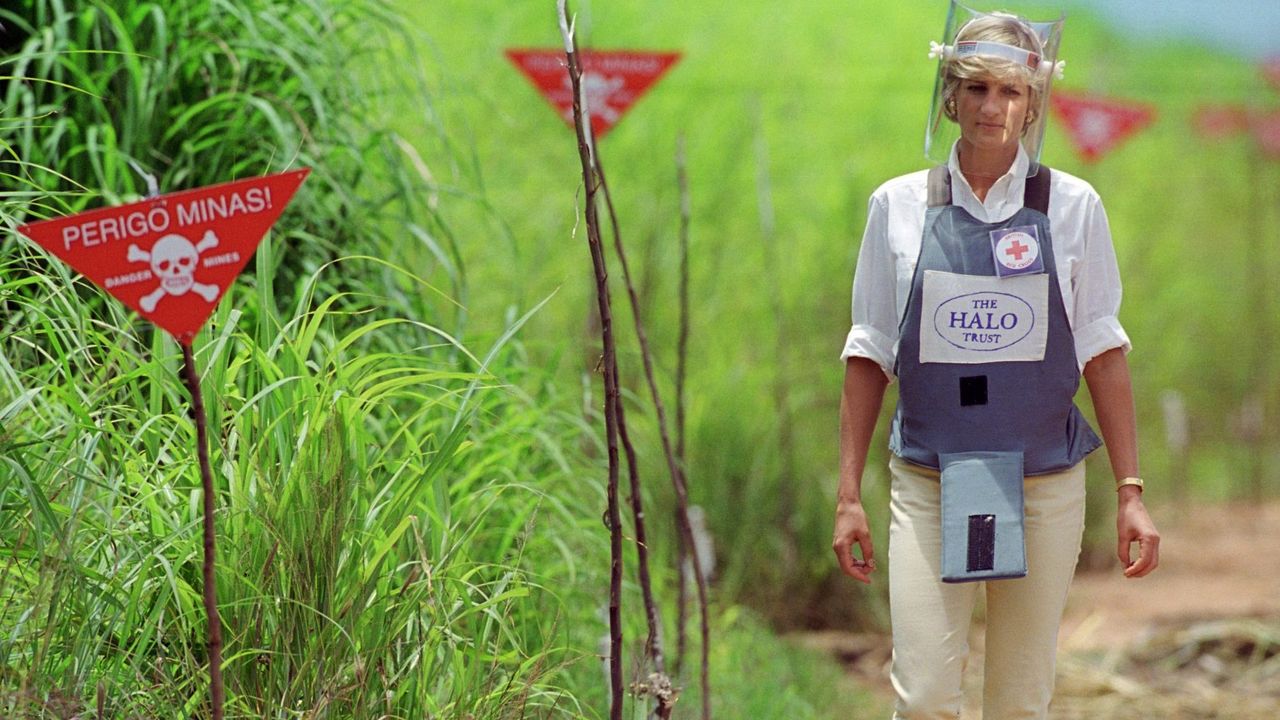 Diana, Princess of Wales wearing protective body armour and a visor visits a landmine minefield being cleared by the charity Halo in Huambo, Angola