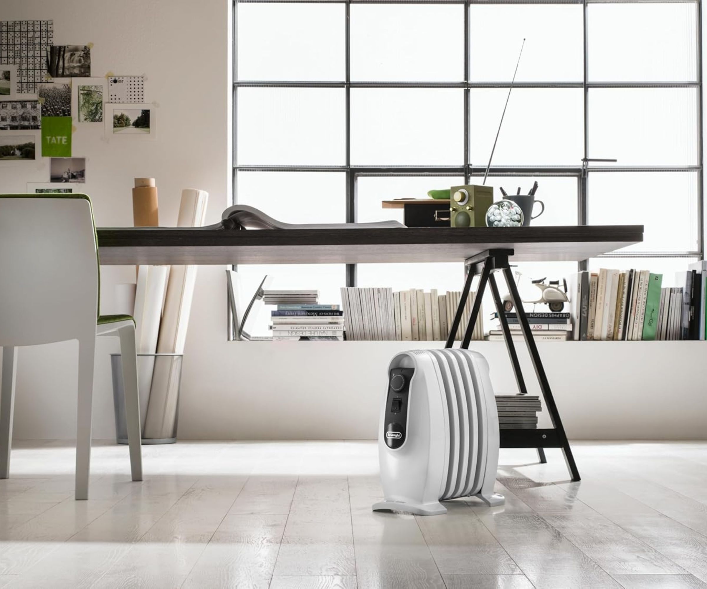 De'Longhi TRNS0505M Oil Filled Radiator next to table in office space